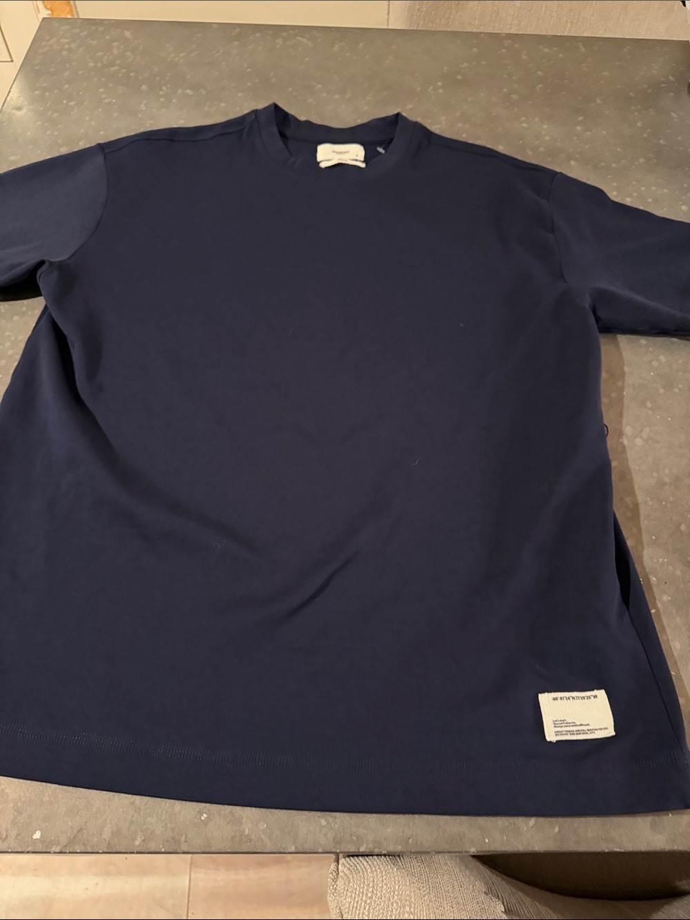 Reserved Navy Crewneck Short Sleeve Tee with Hem Patch. Upscale Tshirt retailer
